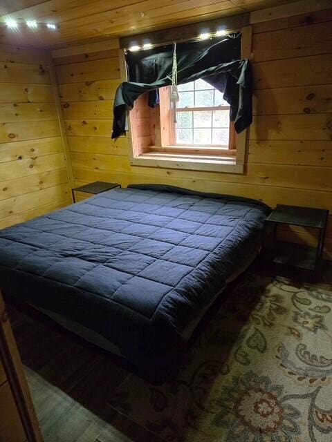 103 Fellows Ln, Winthrop, ME 04364 - bedroom featuring wooden walls and wood ceiling