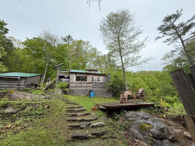 103 Fellows Ln, Winthrop, ME 04364 - view of yard featuring a deck and a forest view