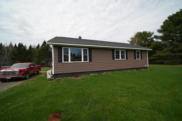 176 Smyrna Center Rd, Smyrna, ME 04780 - view of side of property featuring a yard and a chimney