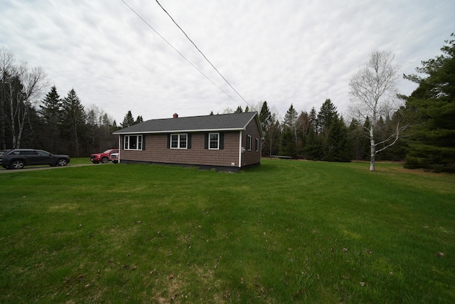 176 Smyrna Center Rd, Smyrna, ME 04780 - view of property exterior featuring a yard