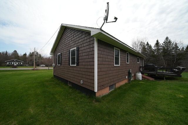 176 Smyrna Center Rd, Smyrna, ME 04780 - view of side of home with a lawn and a deck