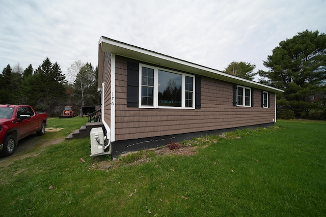 176 Smyrna Center Rd, Smyrna, ME 04780 - view of side of home featuring a yard