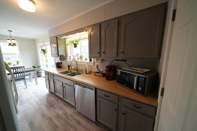 176 Smyrna Center Rd, Smyrna, ME 04780 - kitchen with dishwasher, black microwave, a sink, light wood-style flooring, and a chandelier