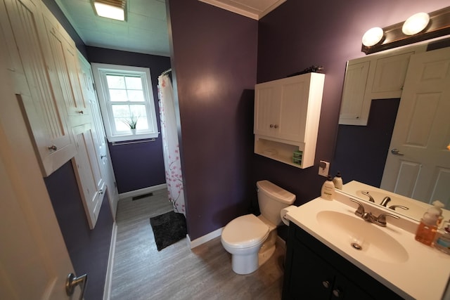 176 Smyrna Center Rd, Smyrna, ME 04780 - full bath featuring wood finished floors, toilet, baseboards, vanity, and a shower with curtain