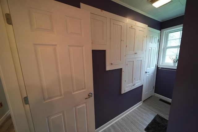 176 Smyrna Center Rd, Smyrna, ME 04780 - doorway to outside featuring light wood-type flooring, baseboards, and crown molding