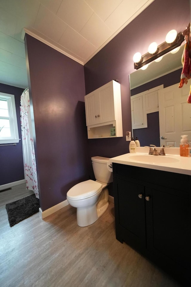 176 Smyrna Center Rd, Smyrna, ME 04780 - bathroom featuring wood finished floors, toilet, vanity, and baseboards