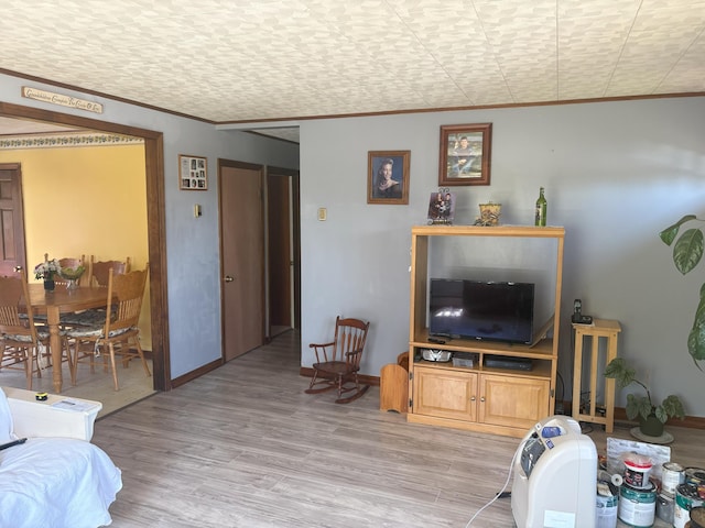 863 Sturtevant Hill Rd, Winthrop, ME 04364 - living room with crown molding, light wood-style flooring, and baseboards