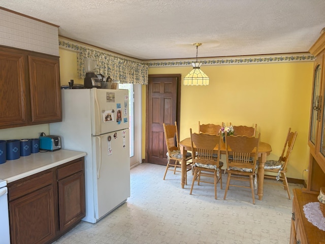 863 Sturtevant Hill Rd, Winthrop, ME 04364 - dining space featuring a textured ceiling and ornamental molding