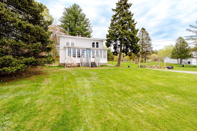 10 River St, Strong, ME 04983 - back of property featuring a deck, a yard, a chimney, and stairway
