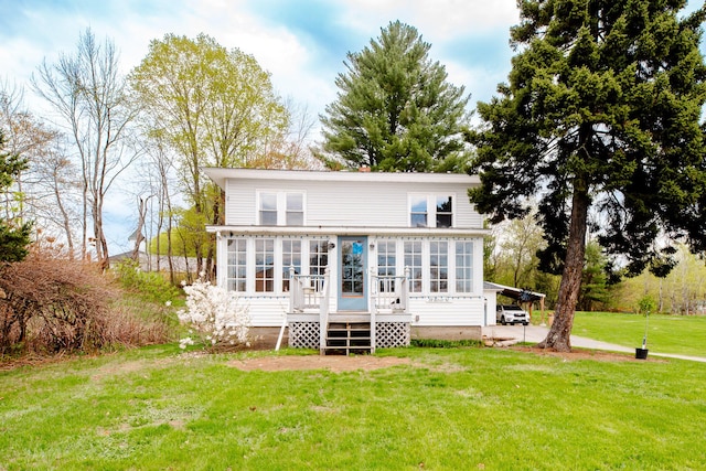 10 River St, Strong, ME 04983 - back of property featuring a sunroom and a lawn