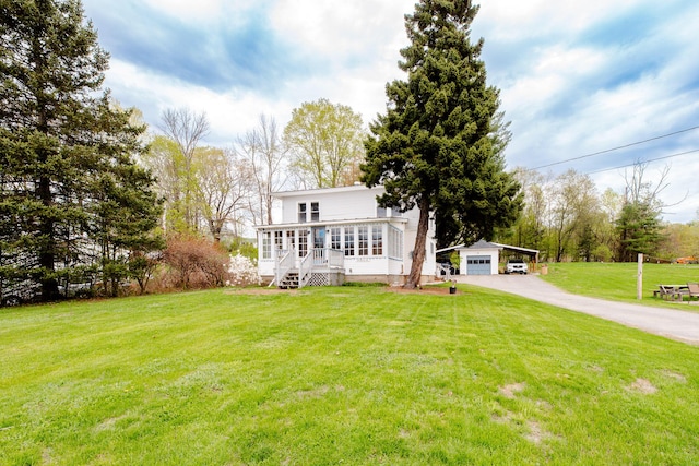 10 River St, Strong, ME 04983 - view of front of property featuring an outbuilding, a garage, and a front yard