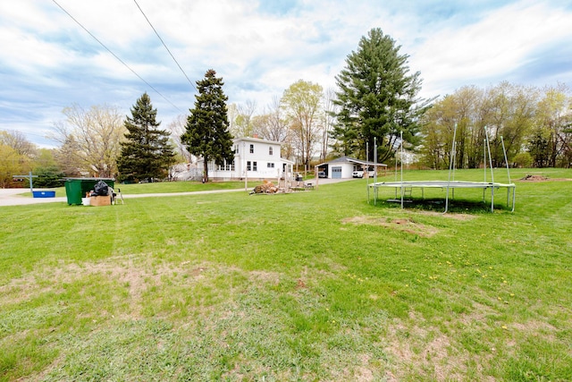 10 River St, Strong, ME 04983 - view of grassy yard featuring a trampoline