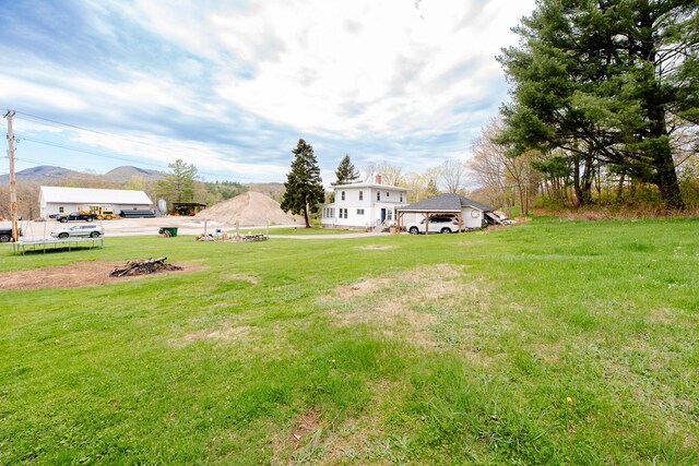 10 River St, Strong, ME 04983 - view of green lawn featuring a mountain view