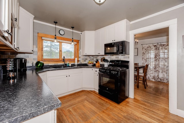 10 River St, Strong, ME 04983 - kitchen featuring black appliances, a sink, dark countertops, and white cabinetry
