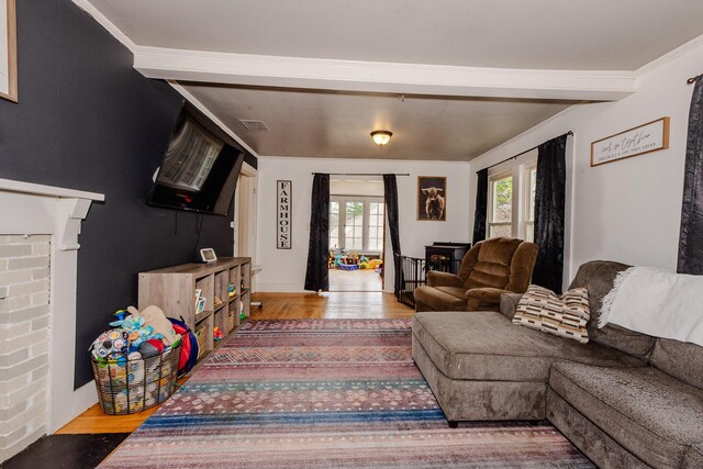 10 River St, Strong, ME 04983 - living area featuring wood finished floors and a fireplace