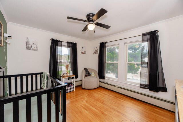 10 River St, Strong, ME 04983 - bedroom featuring multiple windows, baseboard heating, and ornamental molding
