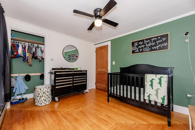 10 River St, Strong, ME 04983 - bedroom with crown molding, baseboards, a crib, and a ceiling fan
