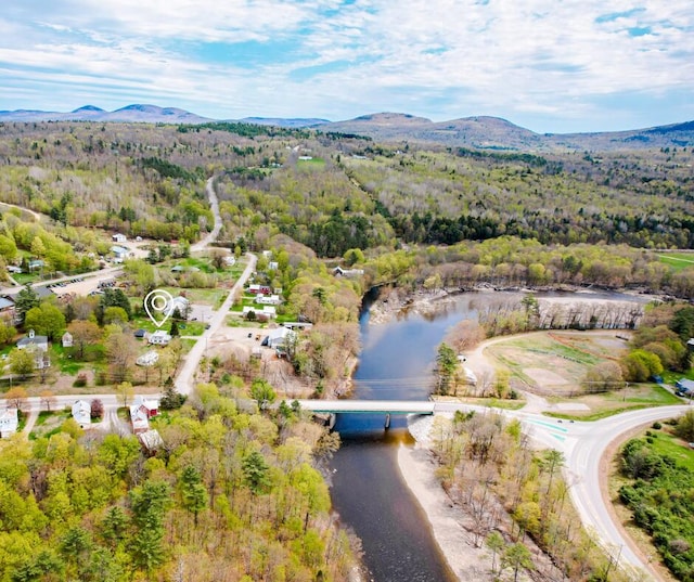 10 River St, Strong, ME 04983 - drone / aerial view of a forest, a water and mountain view, and a notable bridge