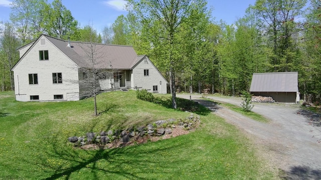 898 Sebec Village Rd, Sebec, ME 04481 - view of front of home with a front yard and dirt driveway