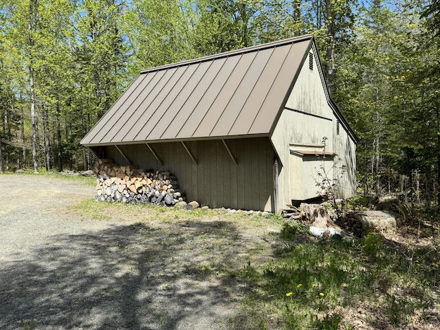 898 Sebec Village Rd, Sebec, ME 04481 - view of barn featuring a forest view