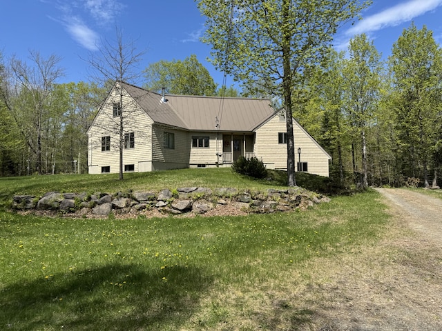 898 Sebec Village Rd, Sebec, ME 04481 - view of side of home featuring a lawn