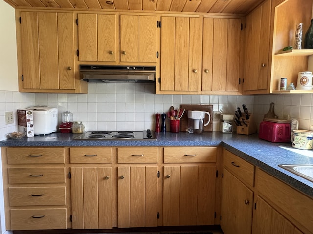 898 Sebec Village Rd, Sebec, ME 04481 - kitchen featuring under cabinet range hood, open shelves, backsplash, electric cooktop, and dark countertops
