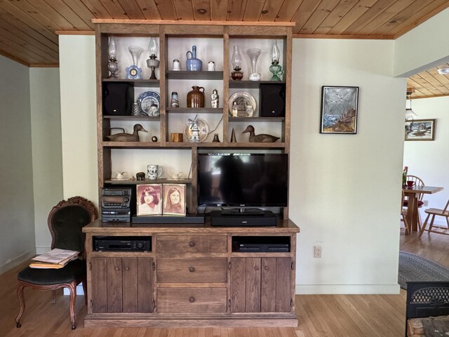 898 Sebec Village Rd, Sebec, ME 04481 - living room featuring wooden ceiling, crown molding, baseboards, and light wood finished floors