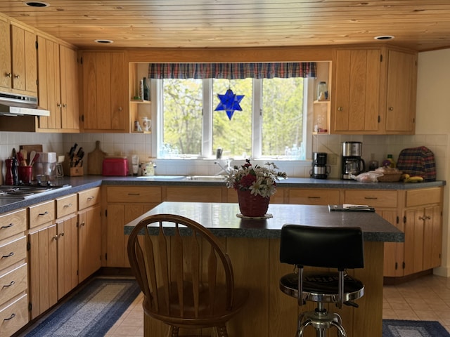 898 Sebec Village Rd, Sebec, ME 04481 - kitchen featuring open shelves, under cabinet range hood, wooden ceiling, cooktop, and dark countertops
