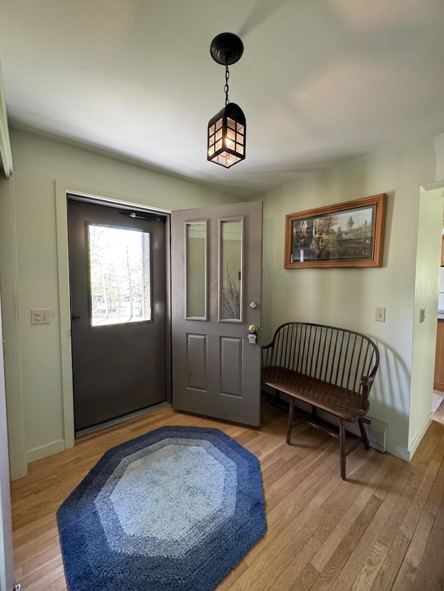 898 Sebec Village Rd, Sebec, ME 04481 - foyer entrance featuring light wood-style floors and baseboards