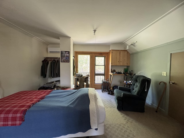 898 Sebec Village Rd, Sebec, ME 04481 - bedroom featuring vaulted ceiling, carpet, and a wall unit AC