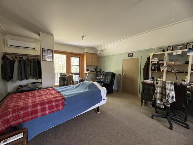 898 Sebec Village Rd, Sebec, ME 04481 - bedroom featuring a wall unit AC, carpet, lofted ceiling, and a desk