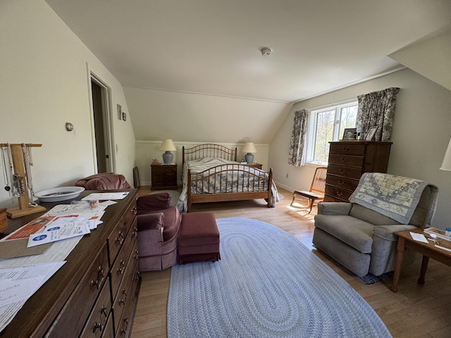 898 Sebec Village Rd, Sebec, ME 04481 - bedroom featuring light wood-style flooring, vaulted ceiling, and baseboards