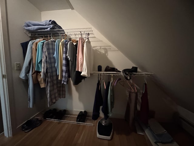 898 Sebec Village Rd, Sebec, ME 04481 - walk in closet featuring wood finished floors and vaulted ceiling