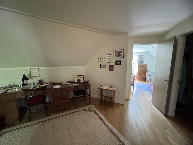 898 Sebec Village Rd, Sebec, ME 04481 - office space featuring wood finished floors, vaulted ceiling, and baseboards