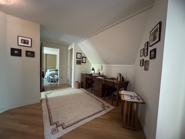 898 Sebec Village Rd, Sebec, ME 04481 - office with wood finished floors, vaulted ceiling, and baseboards