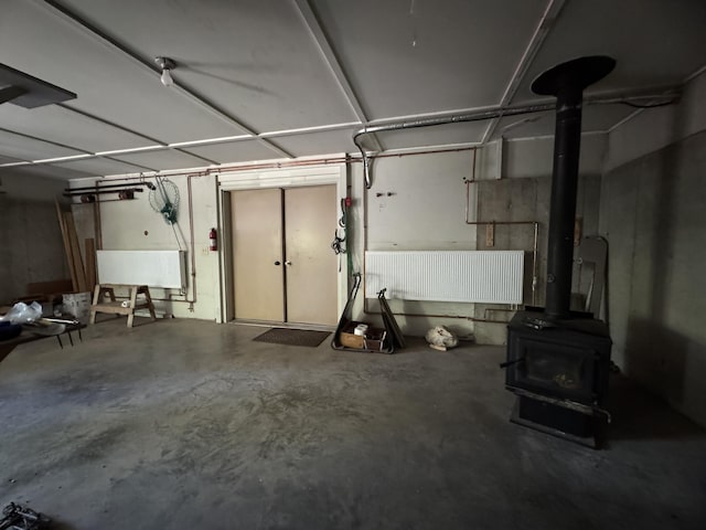 898 Sebec Village Rd, Sebec, ME 04481 - garage with a wood stove