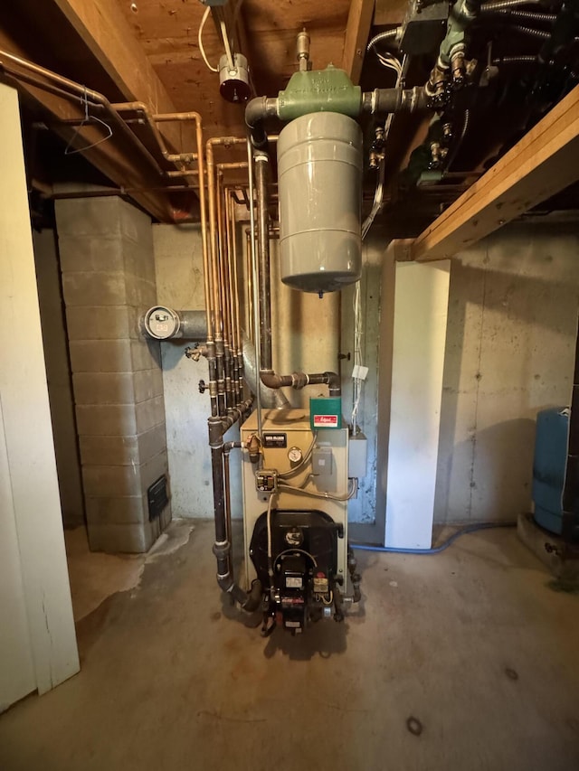 898 Sebec Village Rd, Sebec, ME 04481 - utility room with a heating unit