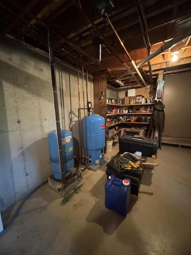 898 Sebec Village Rd, Sebec, ME 04481 - unfinished below grade area with a water pressure tank