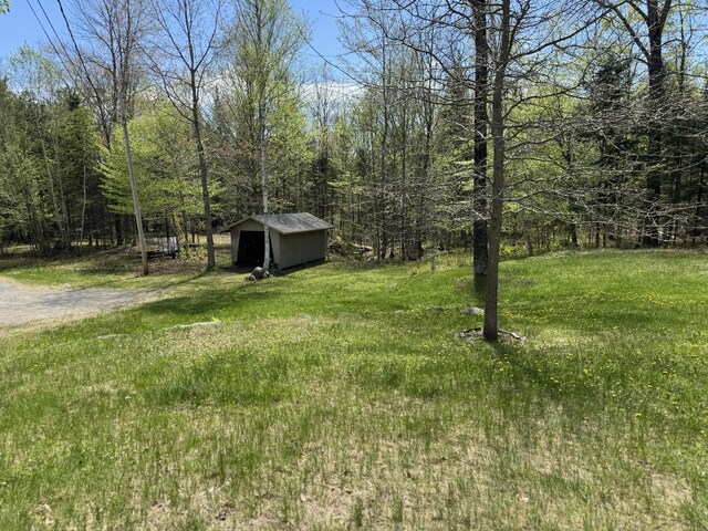898 Sebec Village Rd, Sebec, ME 04481 - view of yard with a shed and an outdoor structure