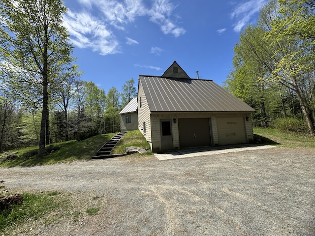 898 Sebec Village Rd, Sebec, ME 04481 - view of side of property featuring metal roof
