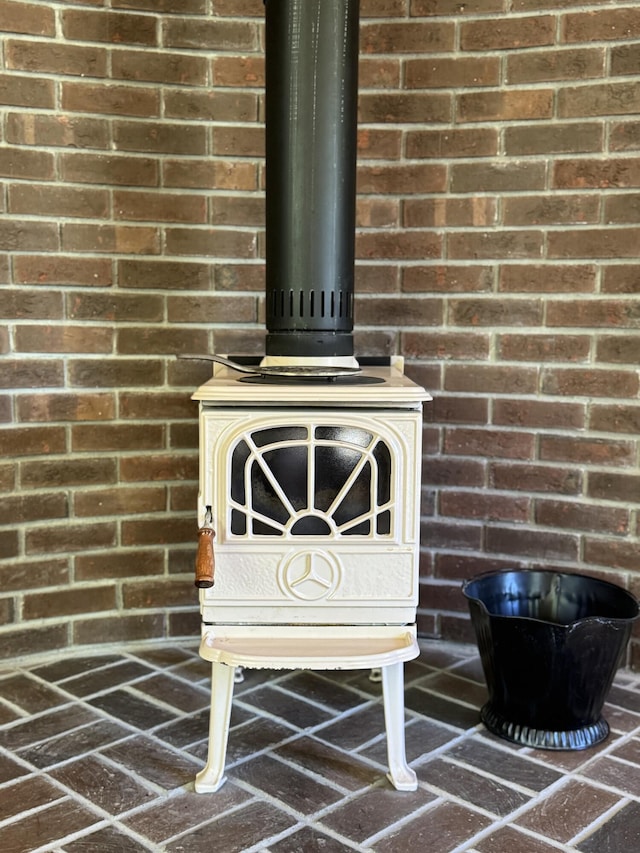 898 Sebec Village Rd, Sebec, ME 04481 - detailed view of a wood stove and brick wall