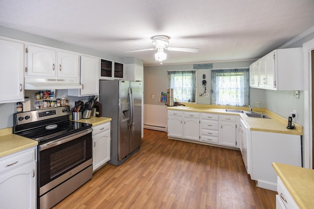 168 Beech Hill Rd, Auburn, ME 04210 - kitchen with stainless steel appliances, under cabinet range hood, baseboard heating, a ceiling fan, and light wood-style flooring