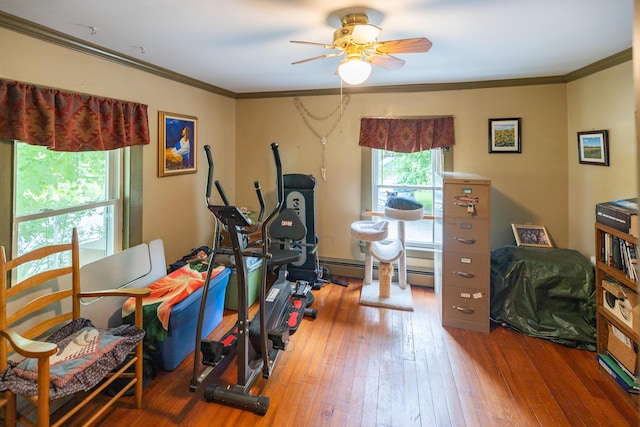 168 Beech Hill Rd, Auburn, ME 04210 - workout area featuring hardwood / wood-style floors, crown molding, ceiling fan, and a baseboard radiator