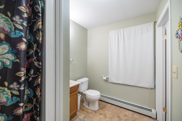 168 Beech Hill Rd, Auburn, ME 04210 - bathroom with a baseboard heating unit, toilet, vanity, and a shower with shower curtain