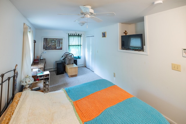 168 Beech Hill Rd, Auburn, ME 04210 - carpeted bedroom featuring a baseboard heating unit, baseboards, and a ceiling fan
