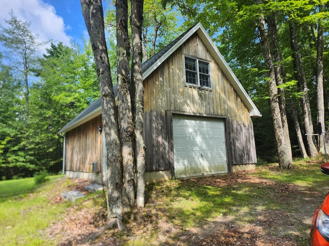 227 Brooks Pond Dr, Corinna, ME 04928 - detached garage featuring dirt driveway
