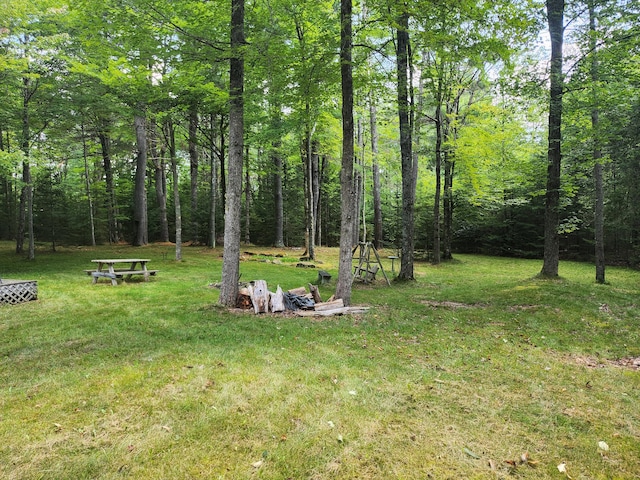 227 Brooks Pond Dr, Corinna, ME 04928 - view of grassy yard featuring a wooded view