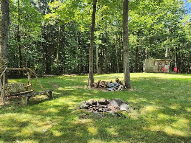 227 Brooks Pond Dr, Corinna, ME 04928 - view of grassy yard featuring an outdoor structure