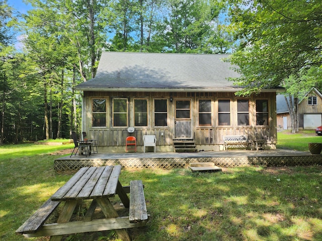 227 Brooks Pond Dr, Corinna, ME 04928 - view of front of house with a deck and a front lawn