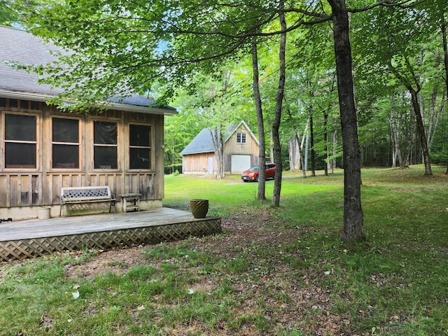 227 Brooks Pond Dr, Corinna, ME 04928 - view of green lawn with a detached garage and an outdoor structure
